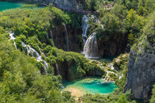 Little Colorful Lake And Beautiful Waterfalls In Plitvice Lakes National Park, Croatia