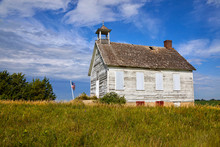Old White Barn Majestically Sitting On Top Of A Hill Against Blue Sky Near Fargo North Dakota