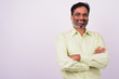 © Ranta Images - Portrait of happy mature handsome bearded Indian businessman