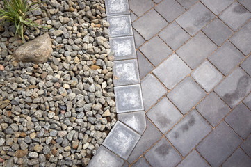 Close-up of garden stone block paved walkway.