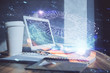 © peshkova - Double exposure of desktop computer and technology theme hologram. Concept of software development.