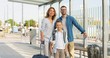 © VAKSMANV - Portrait of Caucasian happy family with suitcases standing outdoors at bus sop or train station. Parents with son travelling in summer. Vacations of child with mother and father Departure for holidays