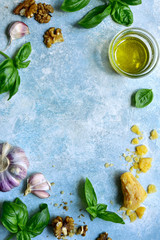 Wall Mural - Fresh ingredients for making traditional italian pesto sauce from basil and cheese. Top view with copy space.