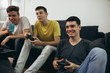 © cherryandbees - teenager boy playing games on console at home
