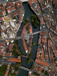 Aerial view of Nuremberg. Island on river Pegnitz. Streets, architecture and light traffic on a summer day. Spinning zoom in footage. Bavaria Germany.