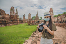 Asian Women A Wearing Face Mask,Woman Camera Take Photo,Asian Women Travel In South East Asia Ayuttaya Thailand,Outdoor New Normal Social Distancing