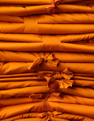 Poster - pile of yellow robe, fold fabric texture