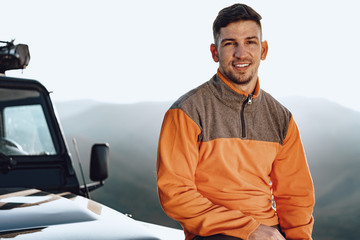 Wall Mural - Portrait of a young caucasian man hiking in the mountains