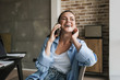 © Drobot Dean - Photo of joyful nice girl laughing and talking on smartphone