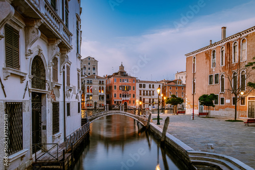 Cuadros en Lienzo Beautiful venetian street in summer day, Italy. Venice Europe