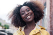 © Viktor Solomin/Stocksy - emotional closeup portrait of black african american woman showing happy laughing emotions