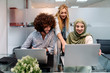 © Santi Nunez/Stocksy - Muslim woman in hijab, a blonde woman and curly hair man working