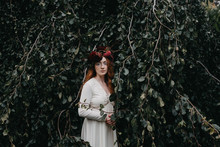Bridal Portraits Of A Beautiful Red Haired Woman Wearing A Flower Crown