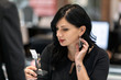 © Sean Locke Photography/Stocksy - Jewelry: Woman Deciding Between Two Sets Of Earrings
