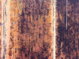 Creative bright metallic background. Flat background texture of dirty rusty metal. Bright rusty spots as the main background for a vintage scratched design