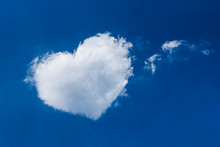 Heart Shaped Cloud On Bright Blue Sky White Clouds