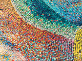 Detail of beautiful old collapsing abstract ceramic mosaic adorned building. Venetian mosaic as decorative background. Selective focus. Abstract Pattern. Abstract mosaic colored ceramic stones