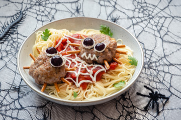 Cutlet look like a spider with spaghetti pasta