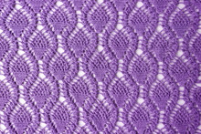 Knitted Pattern Of Violet Wool. Background For Needlework. Top View.