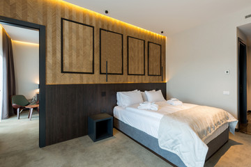 Wall Mural - Interior of a hotel bedroom with wooden wall