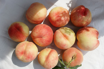 Fresh sweet ripe peaches as background