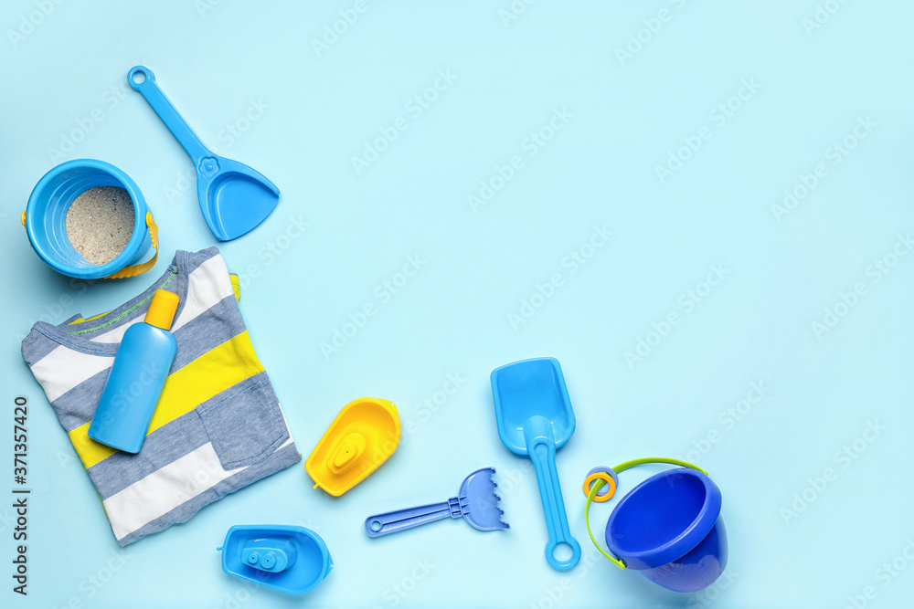 Set of beach accessories for children on color background