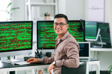 Wall Mural - portrait of male programmer in office