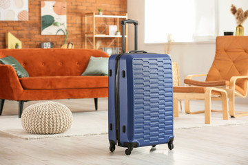 Packed suitcase at home. Travel concept