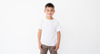 © Ievgen Skrypko - Cute little boy wearing blank white t shirt on a white background