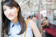 © Paylessimages - 電車に乗る女性