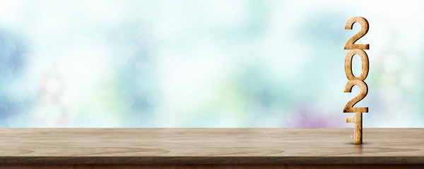 Aufkleber - Happy New Year 2021 wood with sparkling star on brown wood table with green bokeh background,Holiday festive celebration concept.Banner mock up for display of product or design content