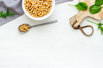 Wall Mural - Vegetarian bowl with chickpeas and vegetables - white table top view copy space