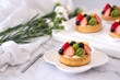 Fresh homemade fruit tart with .grape, strawberries and  blueberries on white background