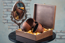 Vintage Decorative Mirror And Wooden Box With Empty Decorative Bowls On Table, Close View, Barbershop Concept 