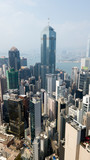 Fototapeta  - Hong Kong / March 28 2018: Aerial view of Hong Kong city. Skyscrapers, office glass buildings business centers near Victoria harbour bay concrete jungle megalopolis cityscape city life. Sunny blue sky