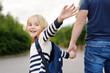 © Maria Sbytova - Little boy with his father going to school after summer break. Education for little kids.