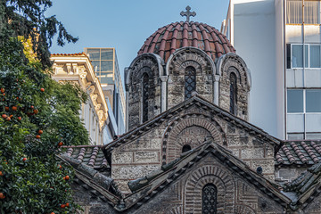 Small Byzantine style church in center of Athens known as Kapnikarea (around 1050) dedicated to Assumption of Virgin Mary, located at busy Ermou Street. Athens. Greece.