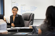 © Tetra Images - Businesswomen talking in office