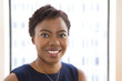 © Tetra Images - African American businesswoman smiling in office