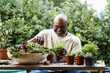 © Tetra Images - Black man gardening at table outdoors