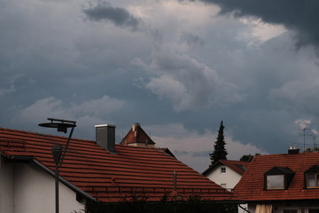 Storm clouds in the evening over a small town.