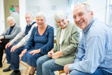 Senior Citizens Participating In Group Event In Retirement Home