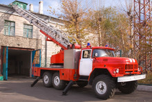 A Large Soviet Red Fire Truck Is Preparing To Leave.
