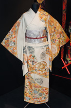 A Japanese Women's Kimono Decorated With Flowers And Cranes