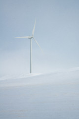 Windmill in Snow Covered Field in Winter