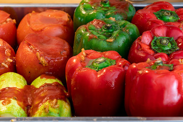 Mediterranean Greek food, Gemista, with red and green peppers, tomatoes, zucchini and rice.