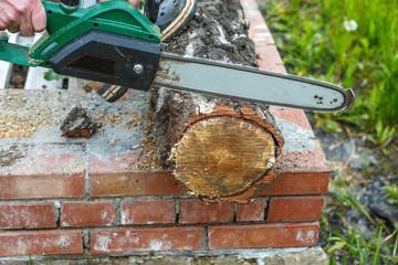 Sawing wood with an electric saw