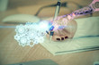 © peshkova - Multi exposure of woman's writing hand on background with data technology hud. Concept of innovation.