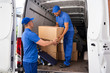 Home Moving Services. Movers Loading Van