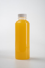 Sticker - fresh liquid food product on blank plastic container bottle mockup. juice in a bottle or beverage product